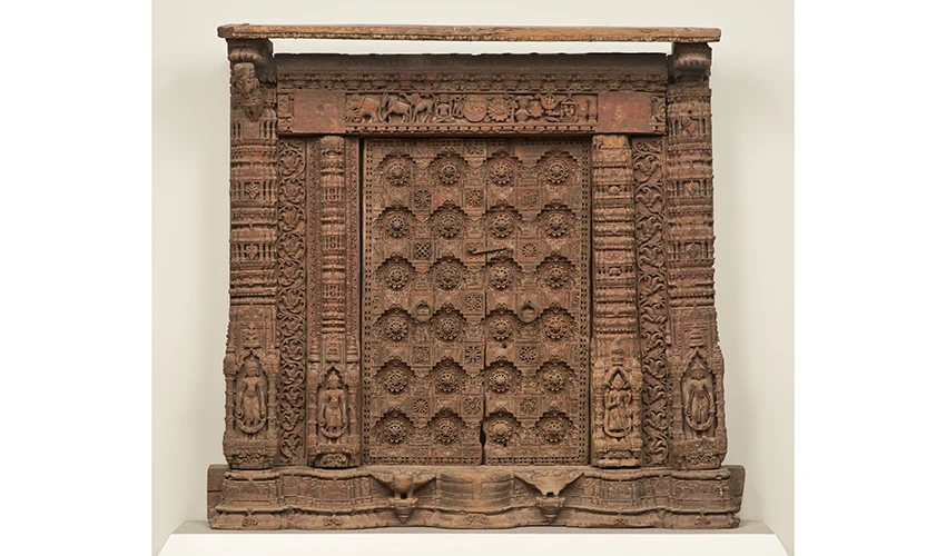 photo of a carved, wood Jain home shrine